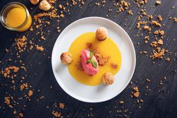 Raspberry ice cream with curable oranges chocolate and puff pastry