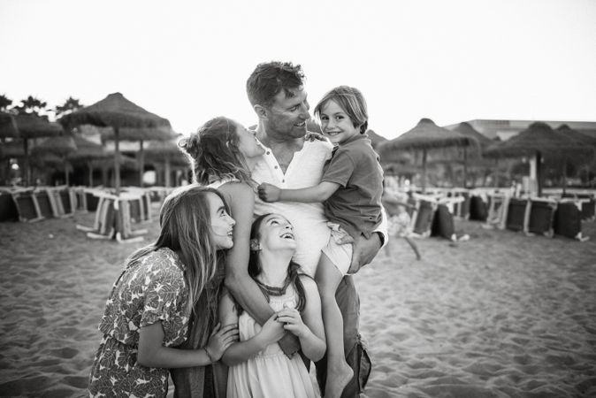 Beautiful happy family with children on beach