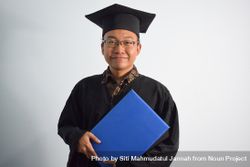 Man posing in graduate shoot holding a certificate 41lpE8