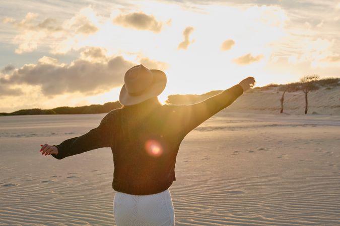 Woman on desert nature during sunset