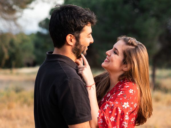 Young happy couple embracing in beautiful garden