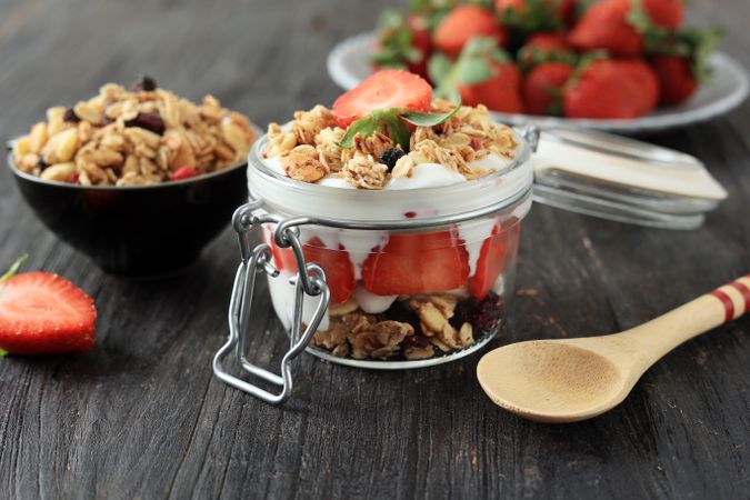 Strawberry Yogurt with Muesli on a Wooden Background