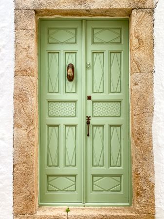 Patmian green door with hand knocker