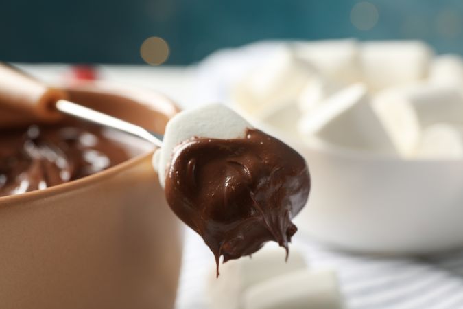 Marshmallow in chocolate, close up. Delicious sweet food