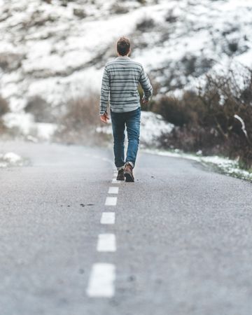 Man walking on country road
