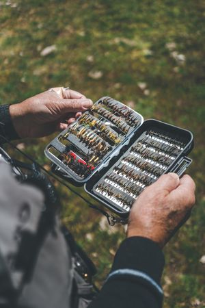 Fisherman demonstrating collection of baiting in box