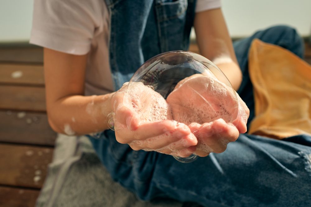 Anonymous kid with soap bubble