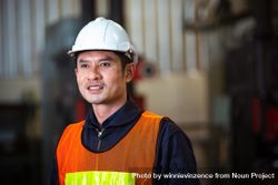 Portrait of Asian man smiling in factory 41rRlb