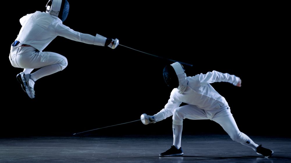 Two Professional Fencers Show Masterful Swordsmanship in their Foil Fight.
