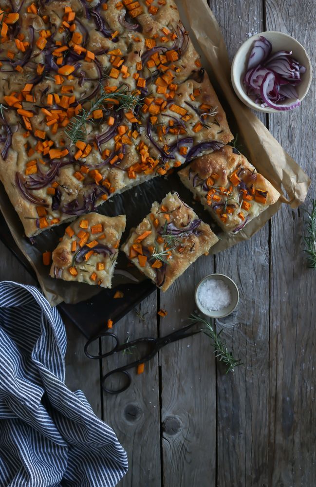 top view of Pieces of fresh focaccia on wooden table