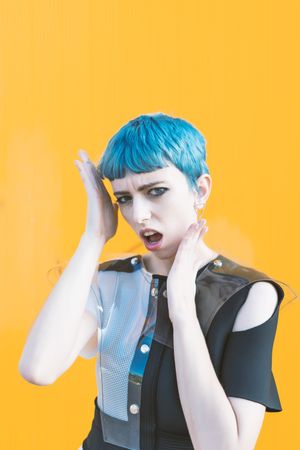 Alternative model portrait against yellow wall