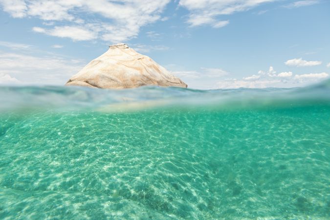 Rocky hill in crystal water