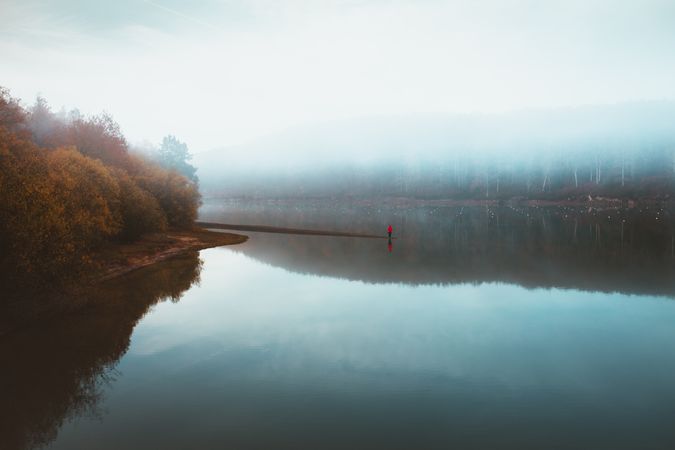 Beautiful tranquil lake in fog