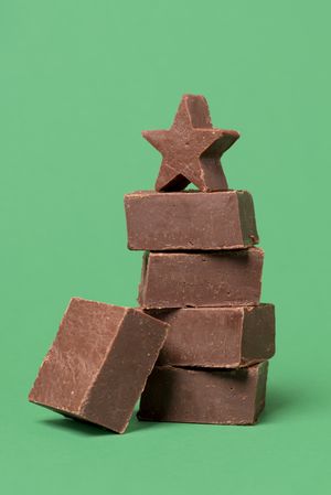 Chocolate fudge isolated on a green background