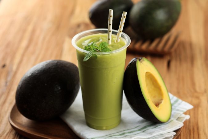 Blended Avocado Juice on Plastic Cup To go