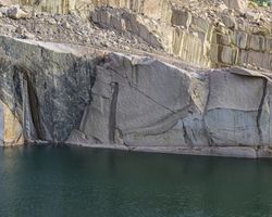 Calm water near stone quarry