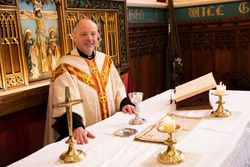 Vicar at altar