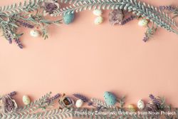Creative layout made with spring flowers leaves and Easter eggs on pastel pink background bGAlx5