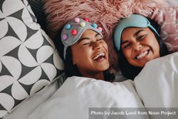 Friends wearing sleeping masks on heads having fun during a slumber party 48aGKb