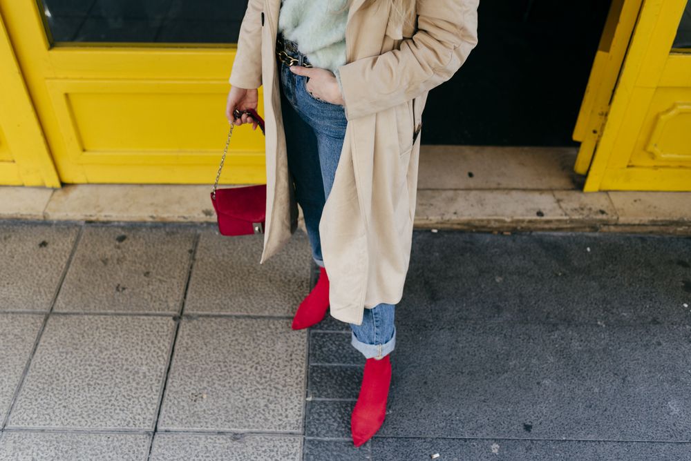 Young stylish woman standing on street