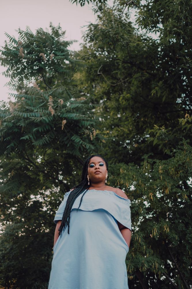 Happy trendy Black woman outside