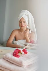 woman using vacuum blackhead remover at home