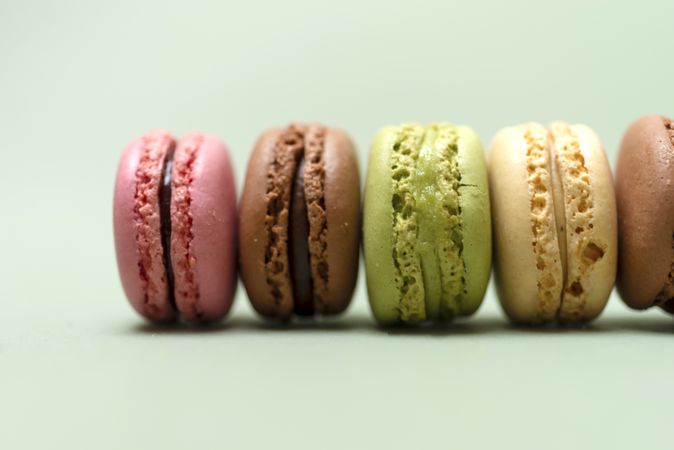 Colorful pastel macaroons lined on a table