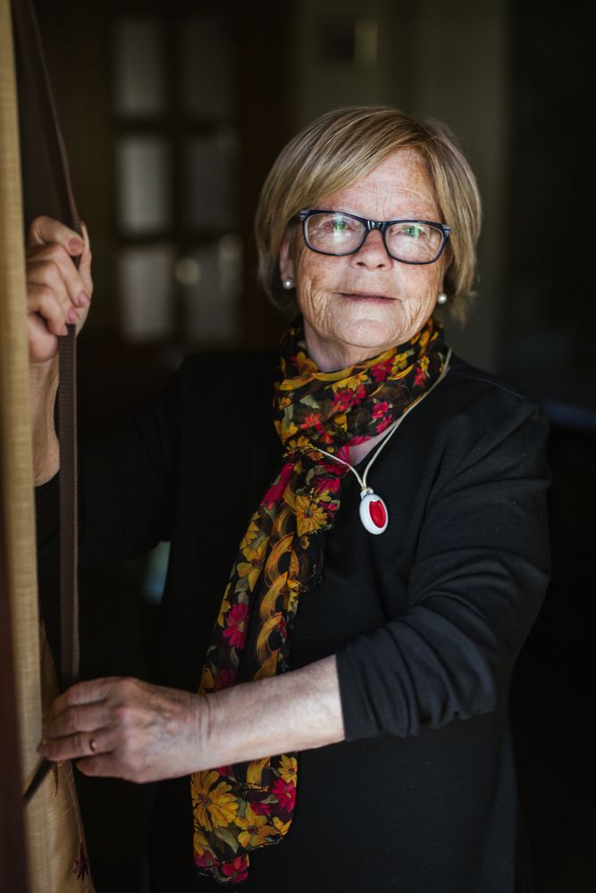Mature woman in glasses looking at camera