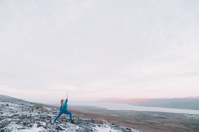 Woman posing on hill in snow