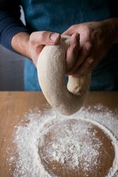 Crop man preparing Rosca de Reyes