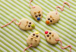 Cookies with mouse shaped and red licorice tail