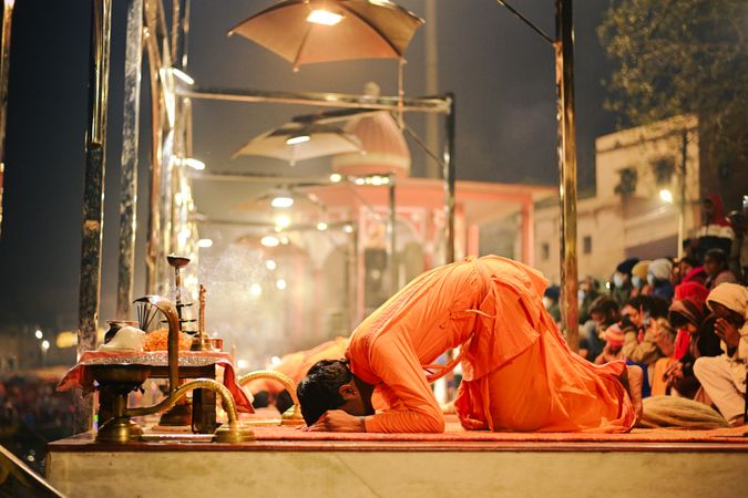 Hindu men praying outdoor at night