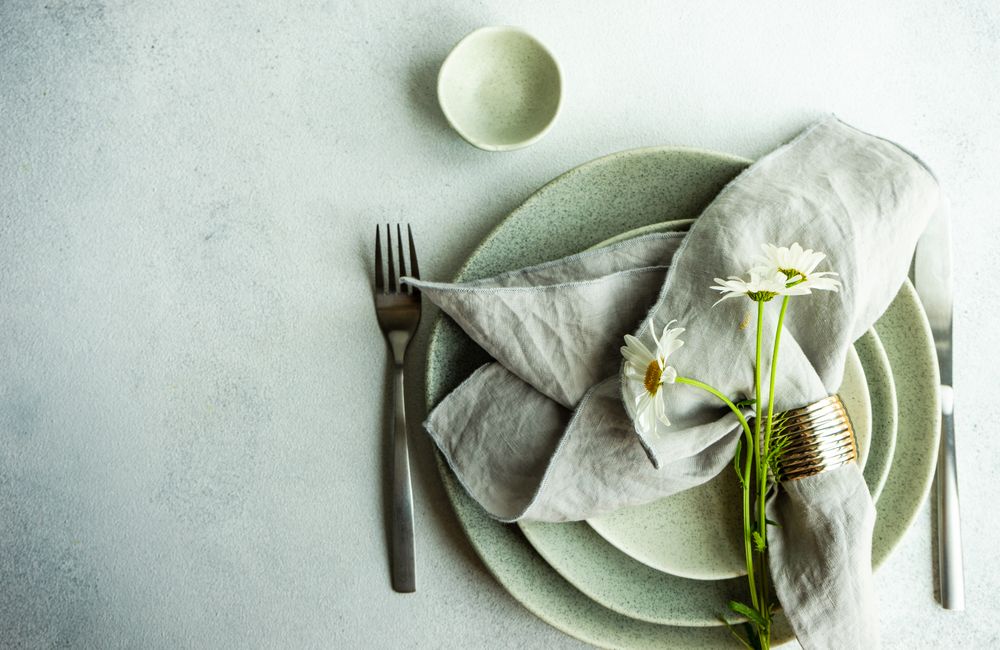 Daisy flowers on a summer table setting with copy space