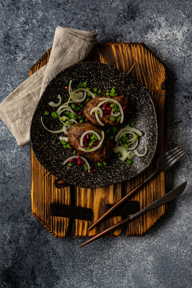 Top view of delicious plate of abkhazura cutlets on plate