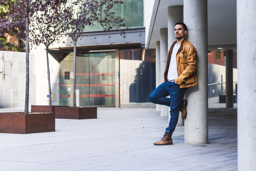 Stylish man outside modern building