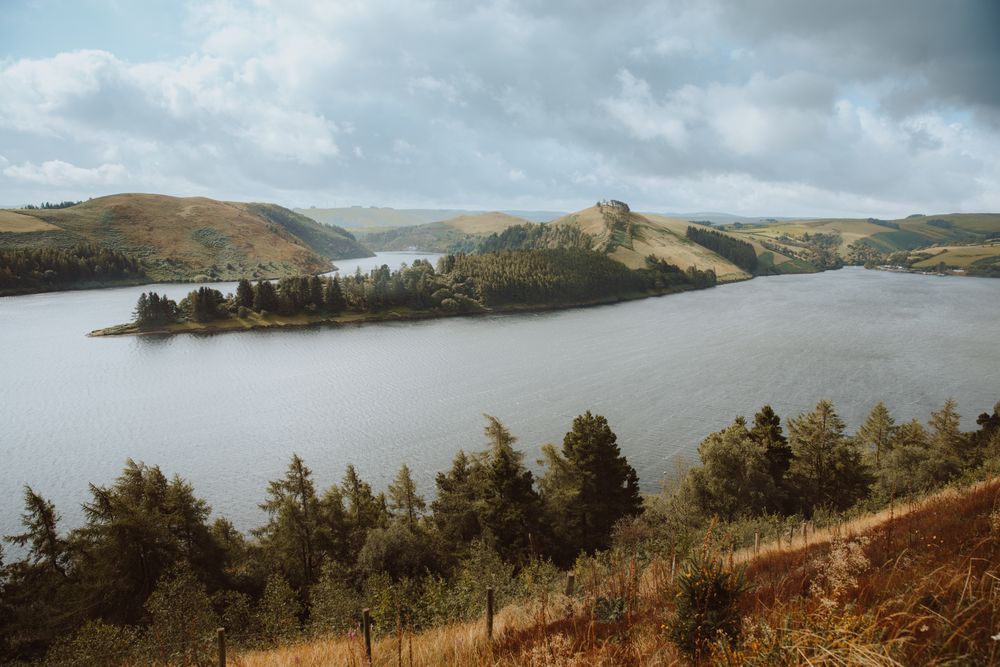 Majestic view of lake surrounded by hills