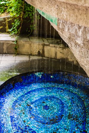 Water fontain with blue mosaic