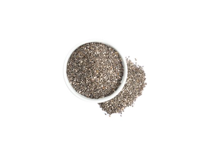 Chia seeds and sauce boat isolated on plain background