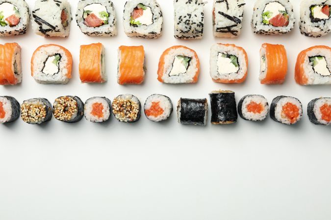 Flat lay with sushi rolls on blank background. Japanese food