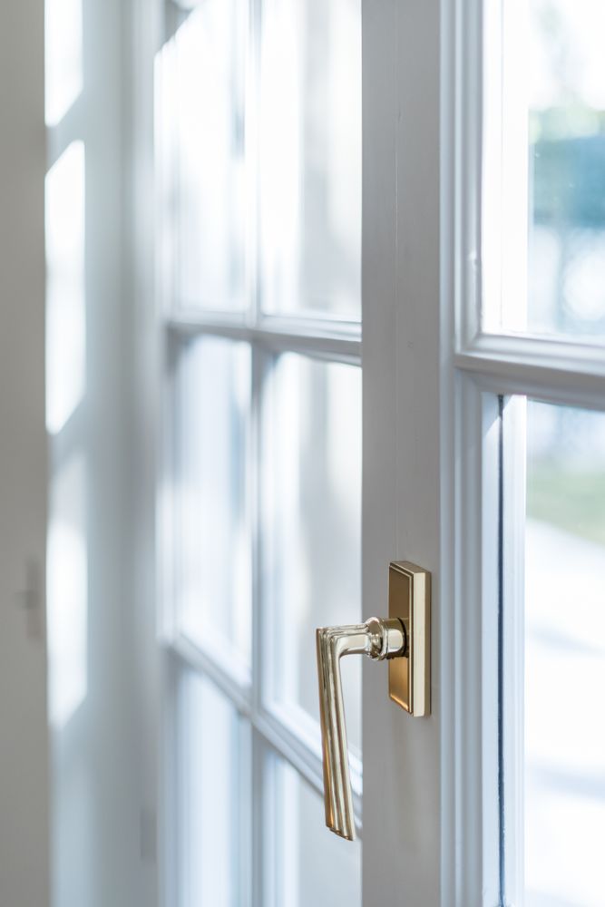 Minimalist balcony door with shiny knob