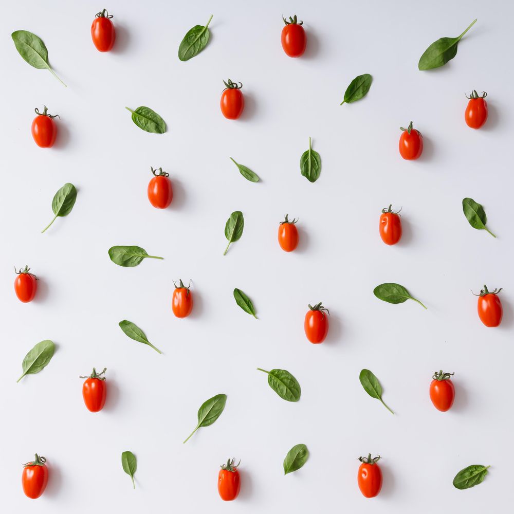 Tomato and basil pattern on light background