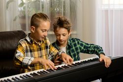 Brothers Practicing Piano Together