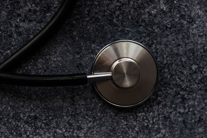 Top view of stethoscope on grey counter