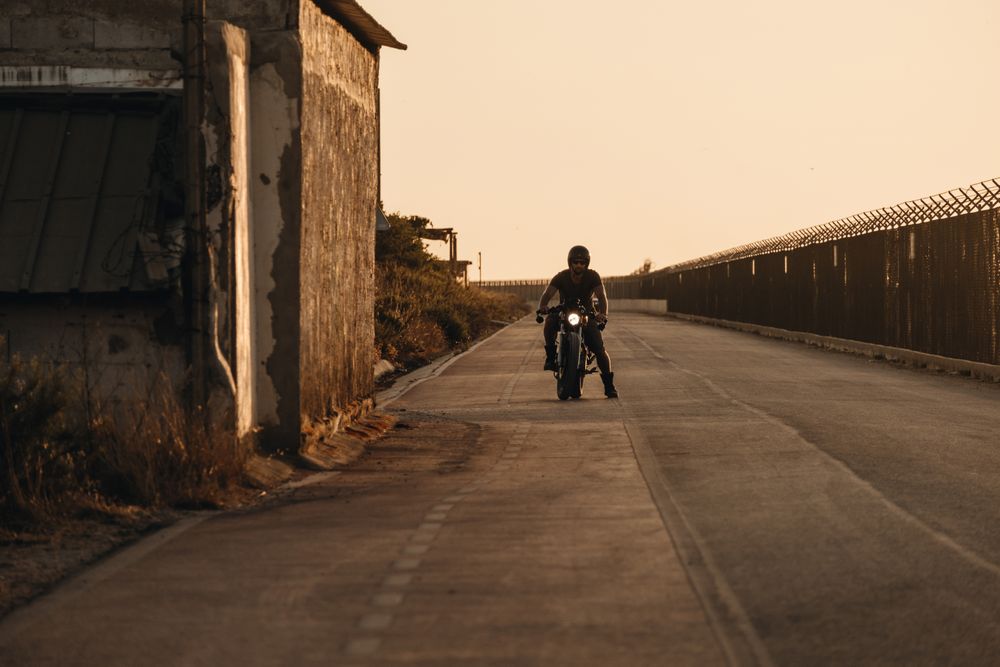 Strong man driving motorcycle