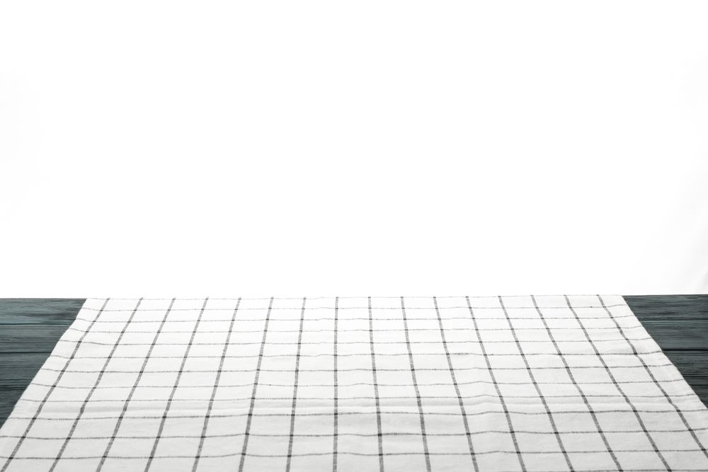 Fabric napkin on table against plain background, space for text