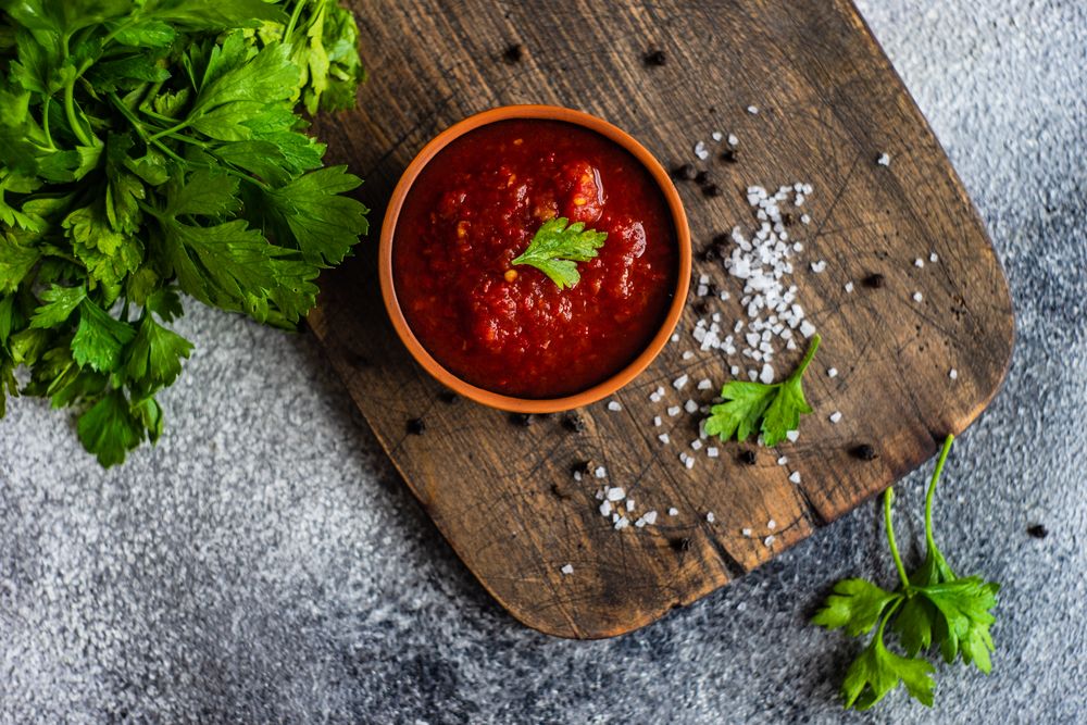 Traditional Georgian sauce on board - satsebeli