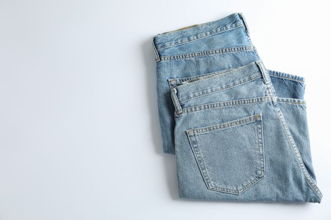 Jeans on light background, space for text