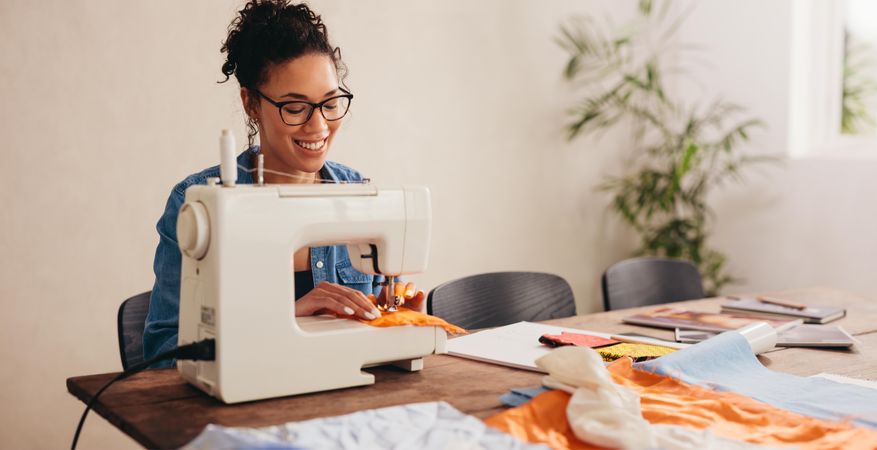 Woman sewing face mask at home