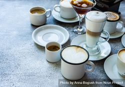 Variety of coffee drinks on table with copy space 0gXXD3