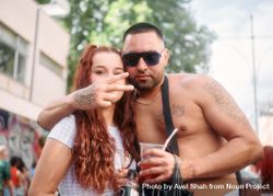 London, England, United Kingdom - August 27, 2022:  Male and female with drinks at street festival 5kBV30